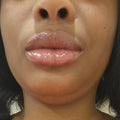 After - Fuller, glossier lips after applying Coco Lip Plumper. See the difference!